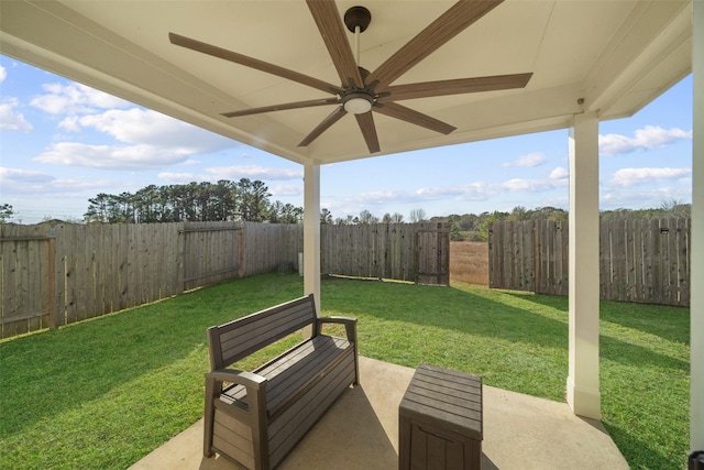 view of yard with ceiling fan and a patio area