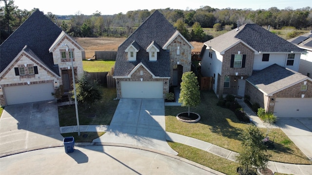 view of front of house with a garage and a front yard