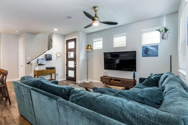 living room with hardwood / wood-style flooring and ceiling fan