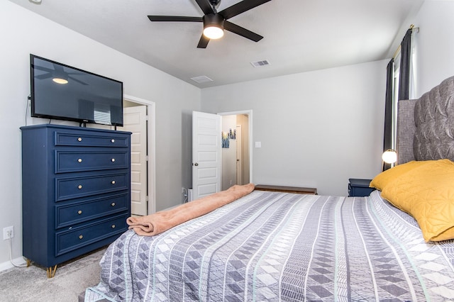 bedroom featuring light colored carpet and ceiling fan