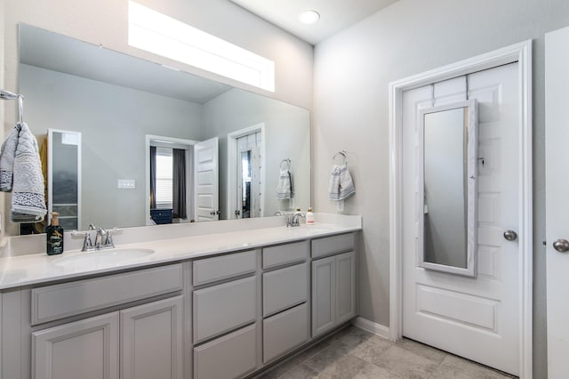 bathroom featuring vanity and a healthy amount of sunlight