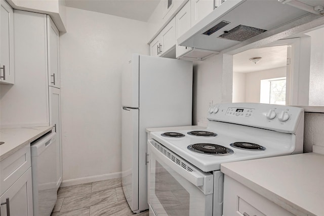 kitchen with white appliances, white cabinets, and range hood