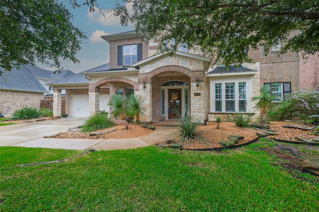 view of front facade featuring concrete driveway, a front lawn, stone siding, and brick siding