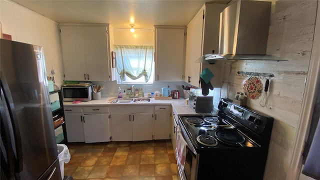 kitchen featuring stainless steel appliances, white cabinets, sink, and wall chimney exhaust hood