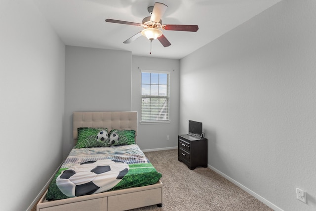 bedroom with ceiling fan and light colored carpet