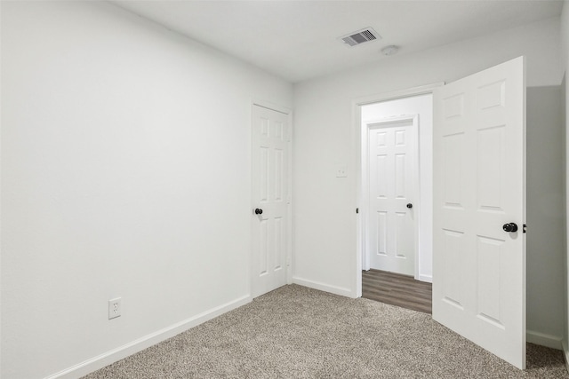 unfurnished bedroom with carpet flooring