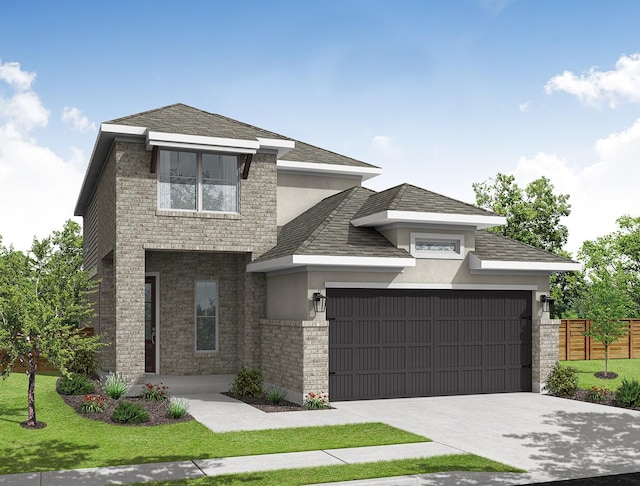 view of front of property featuring a front lawn and a garage