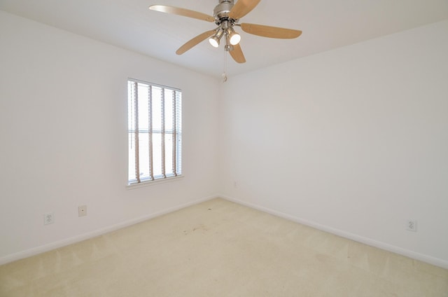 unfurnished room featuring ceiling fan and light colored carpet