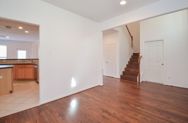 unfurnished living room featuring light hardwood / wood-style floors