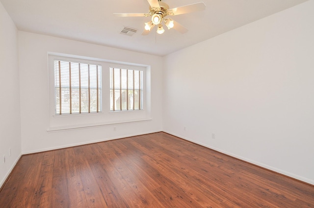 unfurnished room with ceiling fan and wood-type flooring