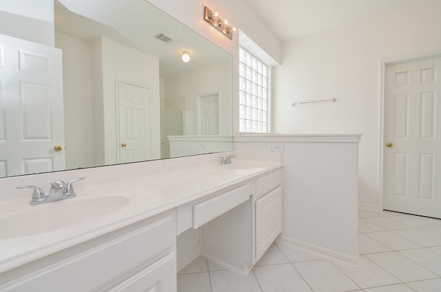 bathroom featuring tile patterned flooring and vanity