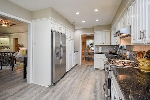 kitchen with stainless steel appliances, sink, white cabinets, ceiling fan, and light hardwood / wood-style floors