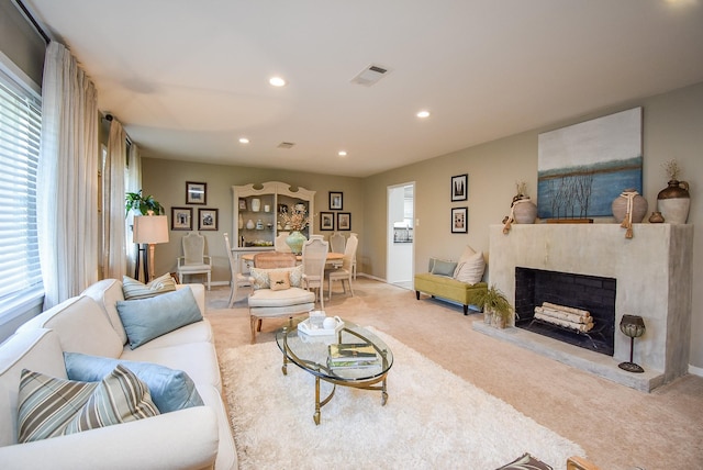 carpeted living room with a healthy amount of sunlight