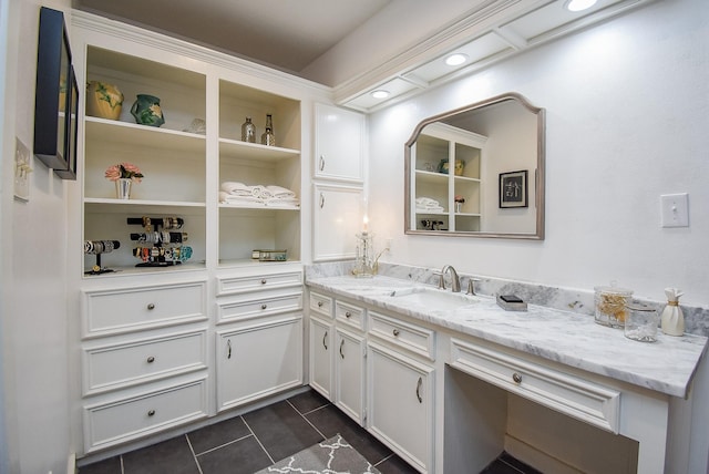 bathroom with tile patterned floors and vanity