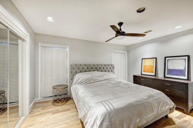 bedroom with ceiling fan and light hardwood / wood-style flooring