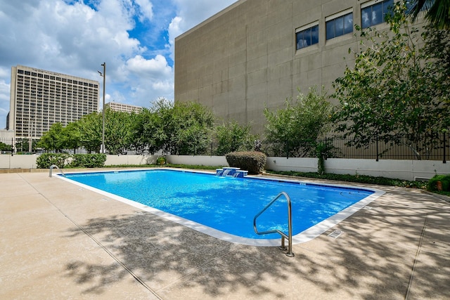 view of pool featuring a patio