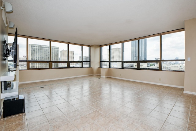 unfurnished living room featuring light tile patterned flooring