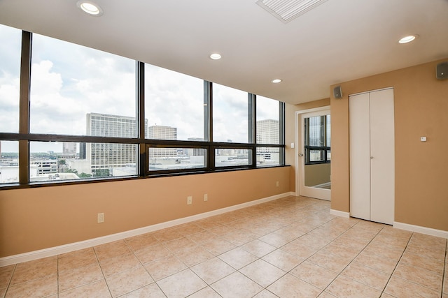 empty room with light tile patterned floors