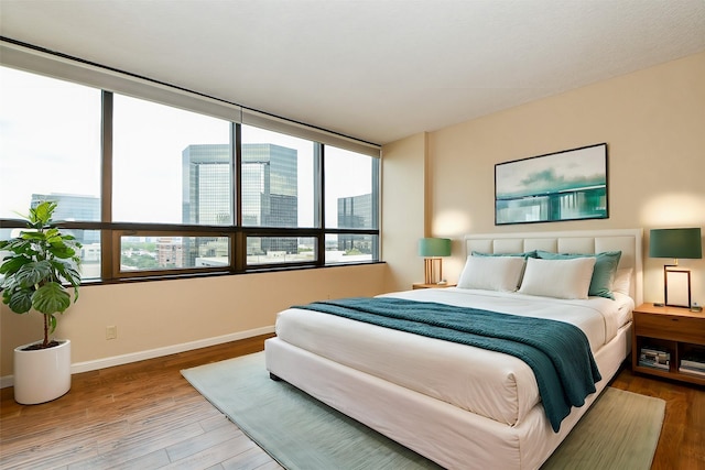 bedroom with hardwood / wood-style floors