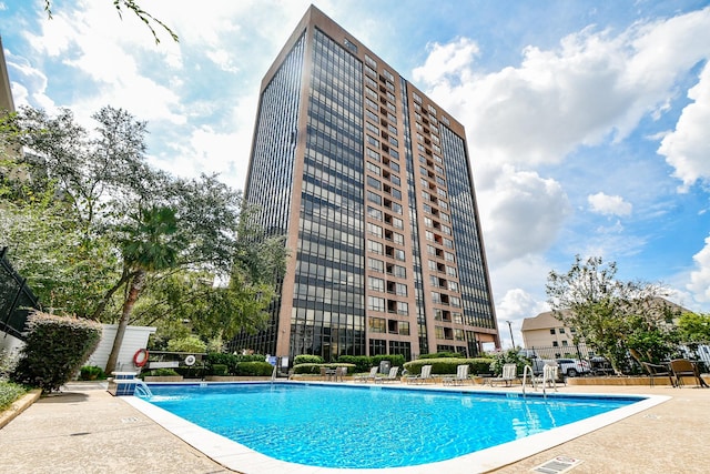 view of pool featuring a patio and pool water feature