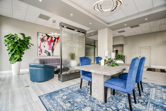 dining room with a paneled ceiling