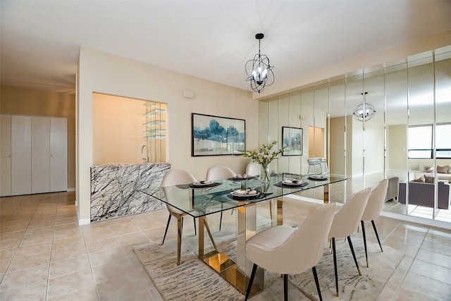 tiled dining area featuring an inviting chandelier