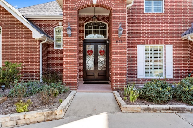 view of exterior entry featuring french doors