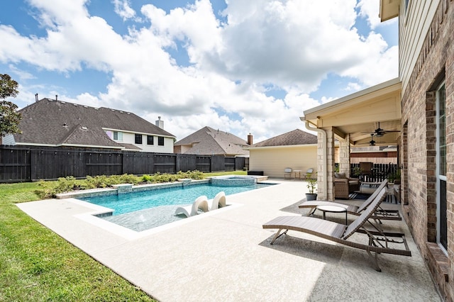 view of swimming pool with ceiling fan and a patio