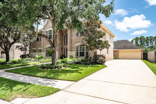 view of front facade with a front yard and a garage