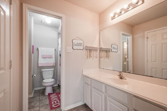 bathroom featuring toilet and vanity