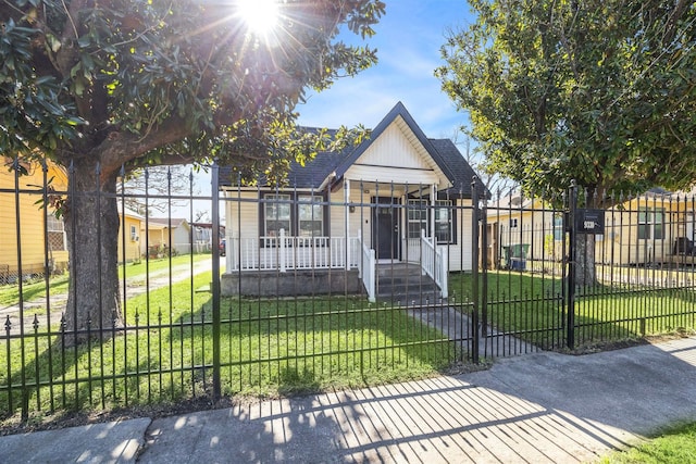 view of front of property with a porch and a front yard