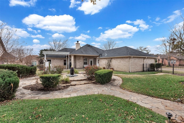 back of property with a lawn and a pergola