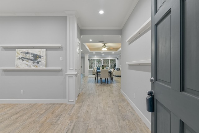 entryway with ceiling fan, light hardwood / wood-style floors, and crown molding