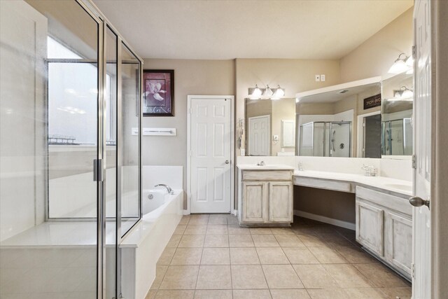 bathroom featuring tile patterned flooring, plus walk in shower, and vanity