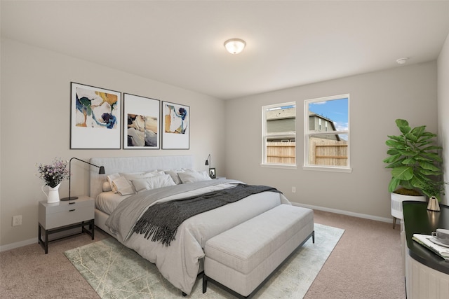 bedroom with light colored carpet