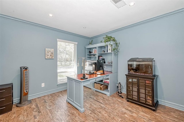 office space featuring ornamental molding and light hardwood / wood-style floors