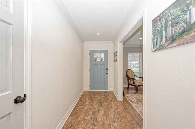 doorway to outside with crown molding