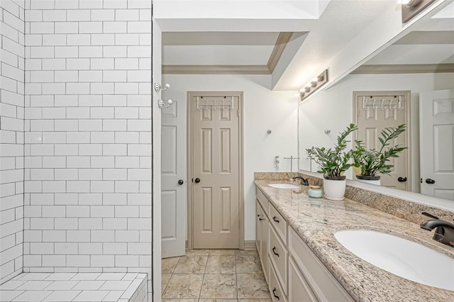 bathroom featuring a shower, vanity, and crown molding