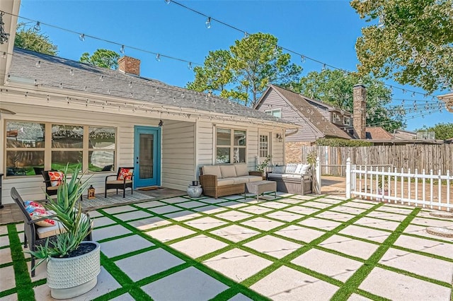 rear view of property with an outdoor hangout area and a patio area