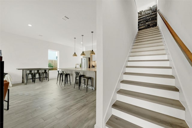 stairway featuring hardwood / wood-style floors