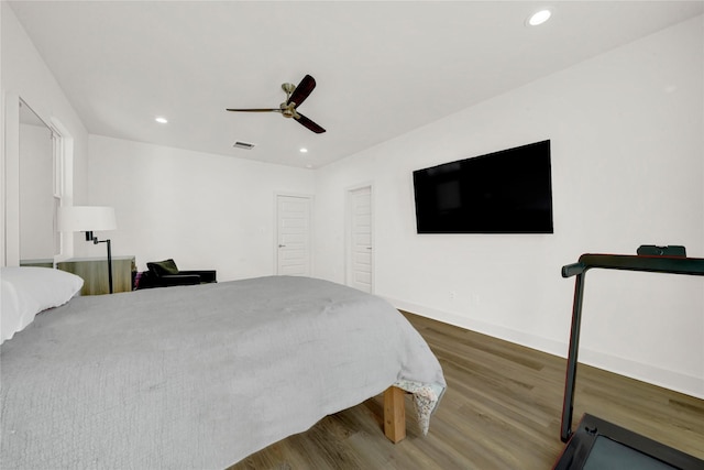 bedroom with ceiling fan and hardwood / wood-style floors