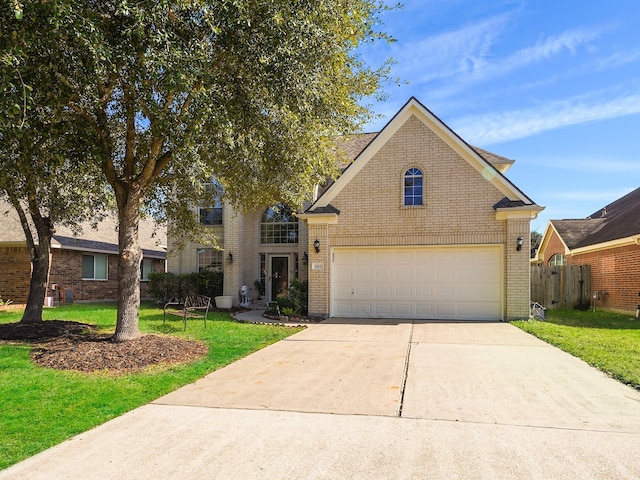 front facade with a front yard and a garage