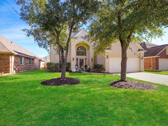 view of front of home featuring a garage and a front lawn