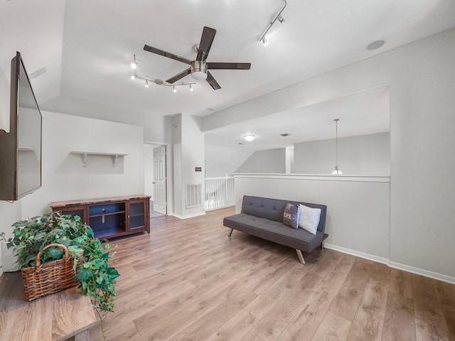 sitting room featuring ceiling fan and light hardwood / wood-style flooring