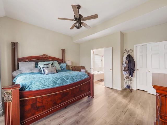 bedroom with lofted ceiling, ensuite bath, ceiling fan, and light hardwood / wood-style floors