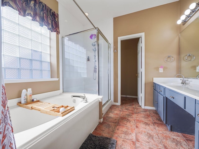 bathroom featuring vanity and independent shower and bath