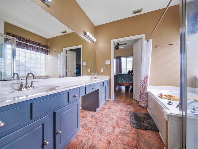 bathroom featuring a tub, tile patterned flooring, ceiling fan, and vanity