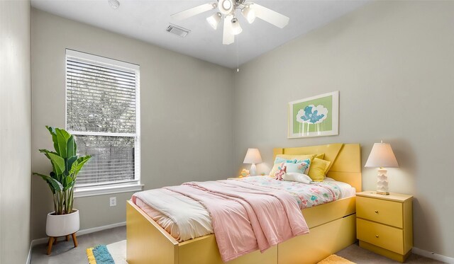 bedroom featuring ceiling fan and light carpet