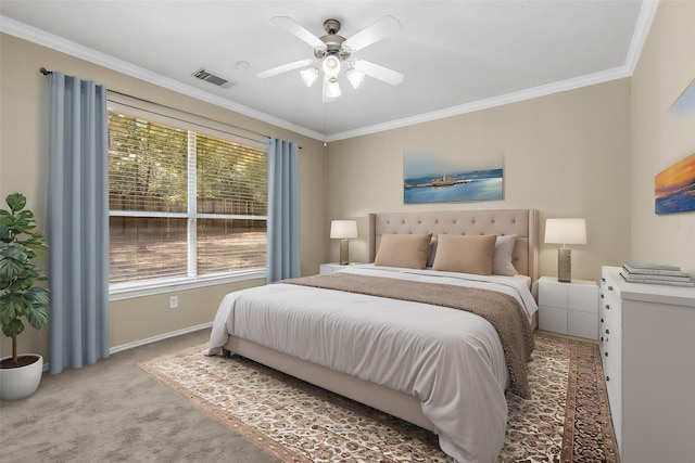 carpeted bedroom with ceiling fan and crown molding