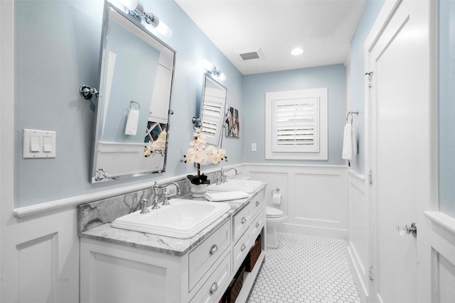 bathroom with tile patterned floors, toilet, and vanity